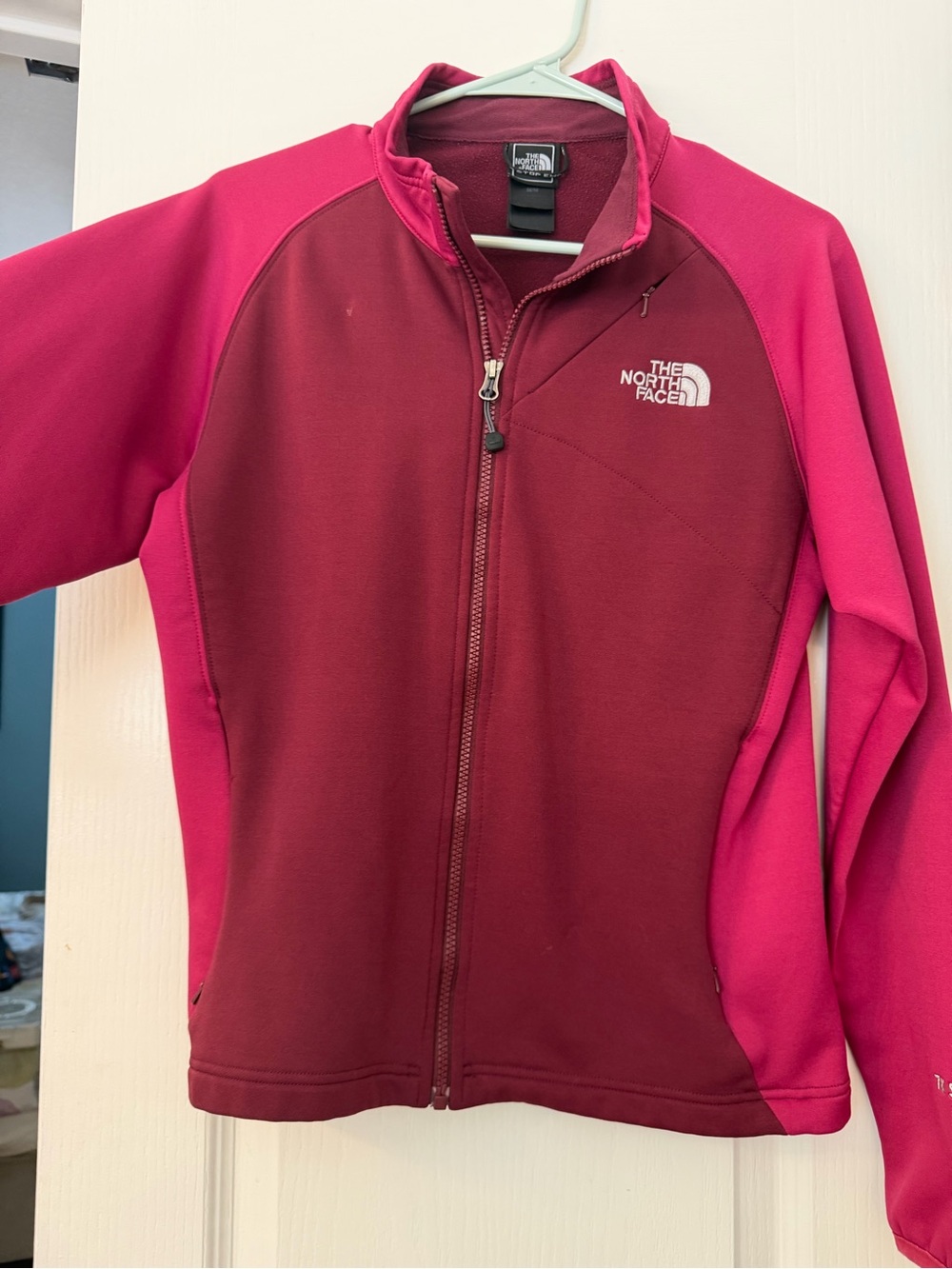 The North Face woman’s pink & Burgundy Fleece Jacket